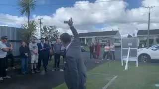 AUCTION! Leanne Stewart of Harcourts Papakura rains bidders on her seller on Prictor Street.