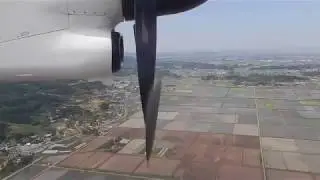 rare view of Bombardier Q400 propeller reverse pitch on landing