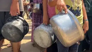 Palestinians in Gaza City queue at a soup kitchen amid dire food shortage