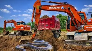 Tractor and truck loading? Excavator loading mud into tractor trolley and dumper truck 