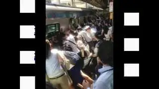 Japanese passengers move 32-tonne train to rescue trapped woman