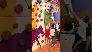 3 year old kid first try rock climbing at playground