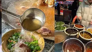 Cooking beef soup rice noodles. street food.