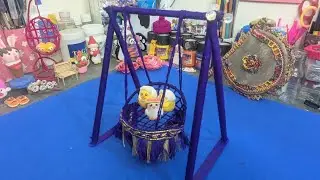 Hanging swing chair in Blue shade, created with sticks, bangle and thread | Mishi Arts 