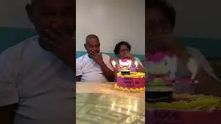 Grandma Startled at Blooming Flower Birthday Candle