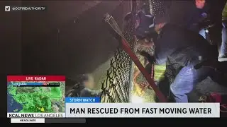 Emergency crews rescue man from moving water in Cypress