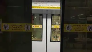 MRT Circle Line (8371) closing doors at CE1 Bayfront