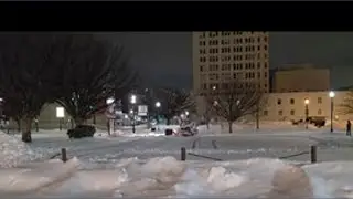 Crews battle snow to clear downtown Louisville parking lots