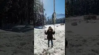 Baby Enjoying Swing in Ushu Forest Amid Snowfall and Sunshine#sumiyaasad00 #UshuForest #Snowfall