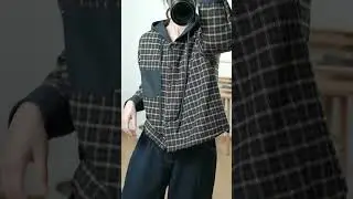Oversized plaid hooded button-up shirt with high-waisted wide-leg dark indigo denim barrel pants