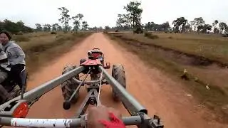 Kubota ZT140 Tractor Driving Home on Dirt Road