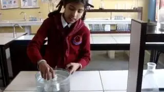 Fifth Standard Student Showing Air Occupy Space in Science Lab at WPS