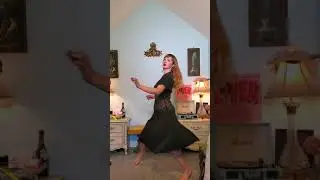 Dainty Rascal dancing in vintage black dress