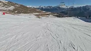 Skiing in Les Sybelles, France, blue route under chairlift 17