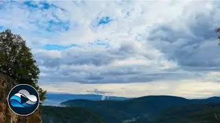 Unfolding clouds over mountains reveal blue skies time lapse, Relax in Nature with Cloud Observe