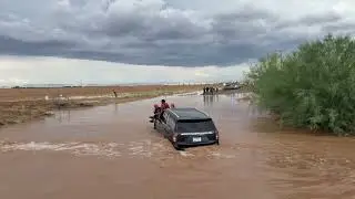 Fire crews rescue 2 people trapped in flooded Maricopa
