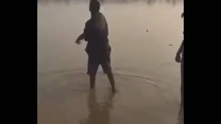 Moment yahoo boys were spotted spraying money into river