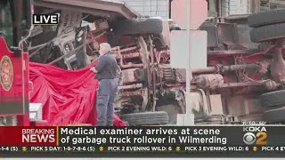 Medical examiner arrives at scene of garbage truck rollover crash