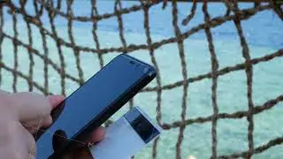Man Hands Holding Credit Card and Using Black Mobile Smart Phone