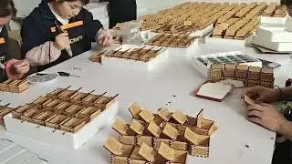 The process of mass-producing music box, .A mass production factory.