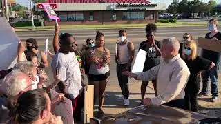 Joliet mayor Bob O'Dekirk talks with protestors