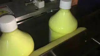Phenyl Bottle sticker labeling Machine.
