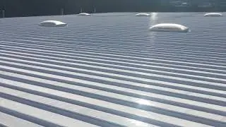 Fresh High Solid Silicone Restoration Over a metal Roofing System. Restore your metal panel system!