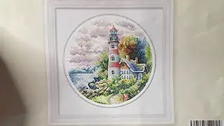Mini Maynia. Stamped cross stitch along lighthouse