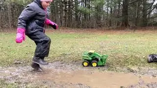 Kids Having Fun Splashing in Muddy Puddles Playing in Mud
