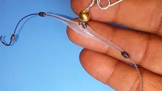 (Spring hook tied) Two hooks knots with straw as a fishing knot.