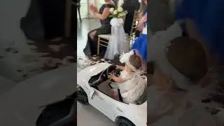 9-month-old flower girl drives down wedding aisle