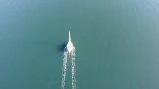 Sailboat Motoring Along in  the Salish Sea
