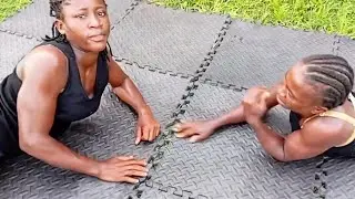 Naturally fit women arm wrestling practice