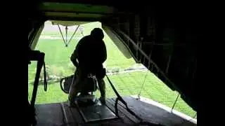 Marine Corps door gunner on the machine gun ch53 flying over helmand province afghanistan