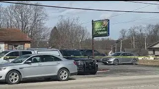 Investigators return to Hubbard massage parlor