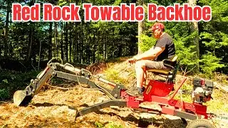 Red Rock /Trencherman Towable Backhoe from Princess Auto moving GRAVEL