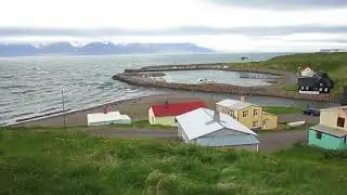 View of Hofsos harbor in Iceland on windy, cloudy day