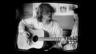 Crispian plays guitar