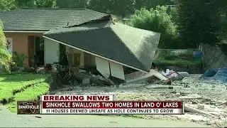 Sinkhole swallows two homes in Land O' Lakes