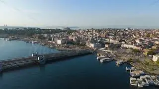 Istanbul, Turkey. Galata Bridge in Fatih district over Golden Horn bay at morning sun with clear ...