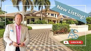 THE MOST INTERESTING HOME IN BOCA GROVE!