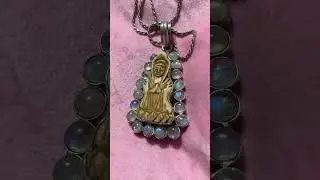 Moonstone carved bone deity, pendant necklace