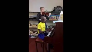 The Romanian Train Song played by Ryan and Victoria - Deseret Community School Uganda