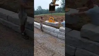 Setting retaining wall blocks #hardscape #concrete #construction #retainingwalls #work #excavator