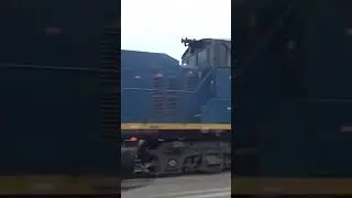 CSX switch engine 1132 trailing on big manifest train.