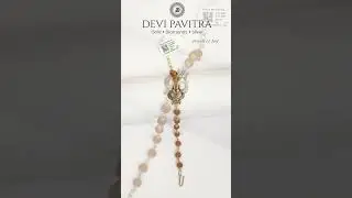 Gold bracelet features Rudraksha beads adorned with a powerful Trishul and Om symbol at the centre