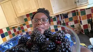 Foraging for blackberries in the forest.