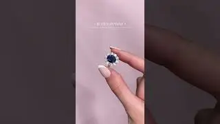 4ct Blue Sapphire in a 1.4ct diamond Cluster Halo engagement ring