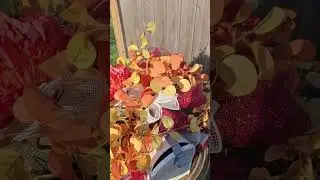 Beautiful mailbox swag with peonies,  hydrangeas, and fall eucalyptus.  #fallarrangement #mailboxes