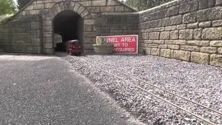 5 inch guge metrovick leaves the tunnel with a long pickup freight